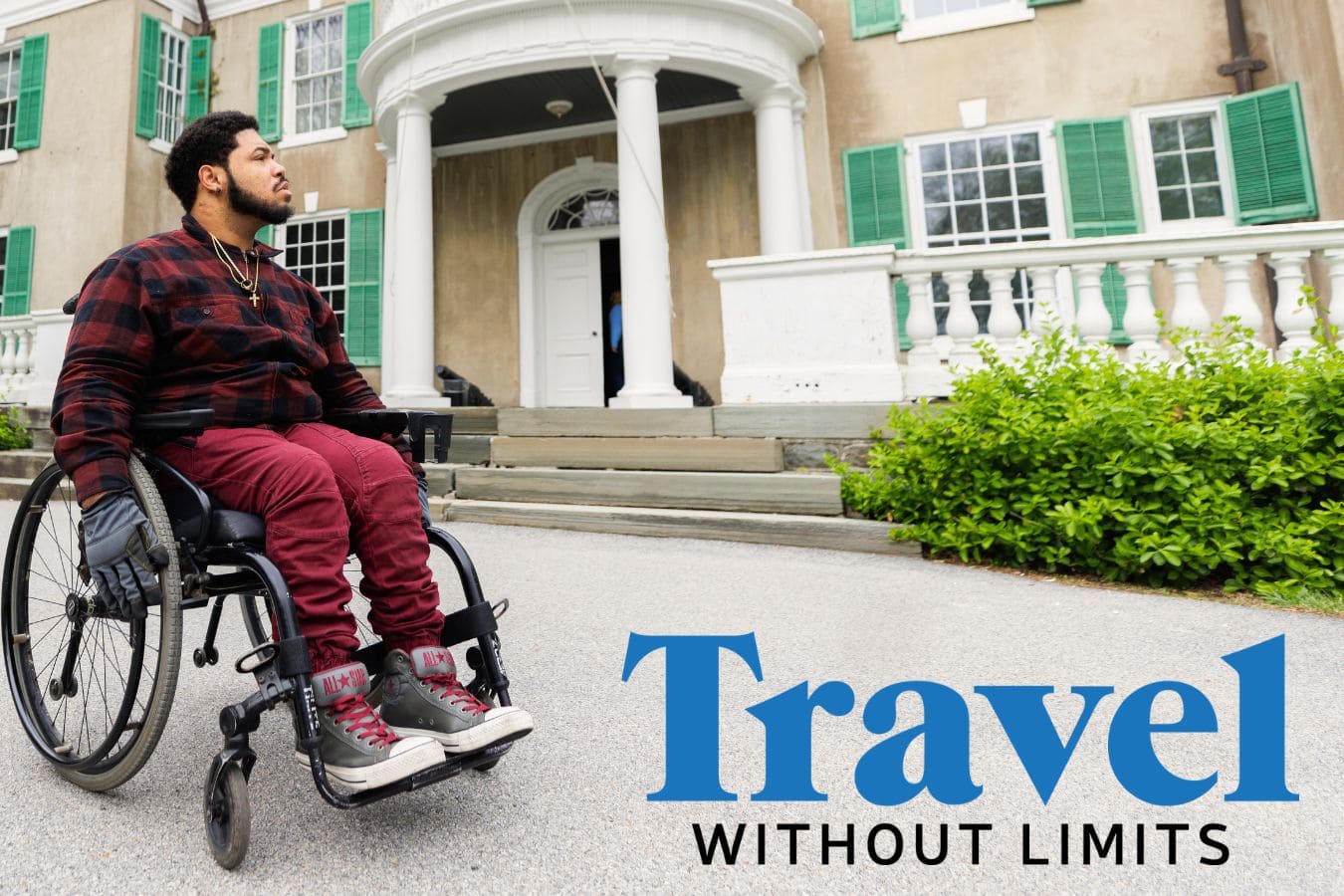 A man in a wheelchair in front of the FDR museum in New York State, with the Travel Without Limits overlaid in the bottom right corner
