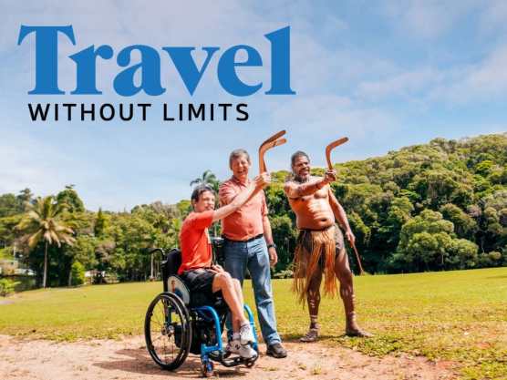Travel Without Limits logo overlaid on image of Braeden and Hubby throwing boomerangs with a First Nations man in Tropical North Queensland